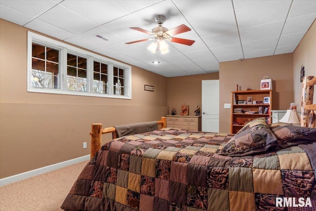 13599 Woodland Dr, Athens, IL 62613 - carpeted bedroom with baseboards, a ceiling fan, and a drop ceiling