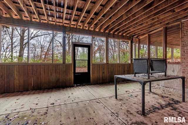 unfurnished sunroom with plenty of natural light