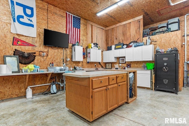 kitchen featuring white cabinets and a center island