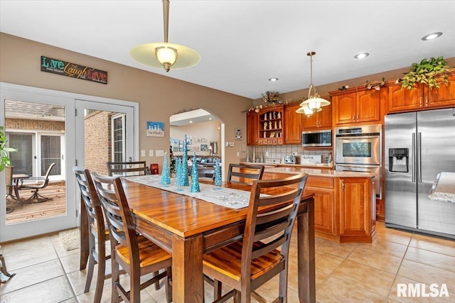 13599 Woodland Dr, Athens, IL 62613 - dining area featuring arched walkways, light tile patterned flooring, and recessed lighting