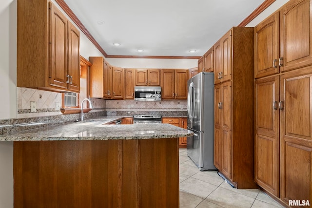 kitchen featuring stainless steel appliances, dark stone countertops, sink, kitchen peninsula, and light tile patterned flooring