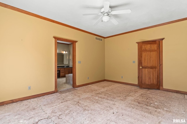 spare room featuring ceiling fan and ornamental molding