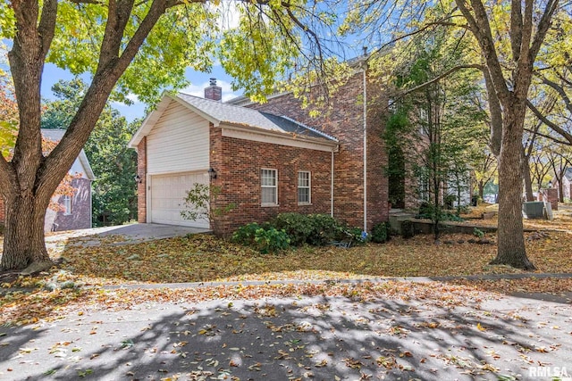 view of side of property featuring a garage