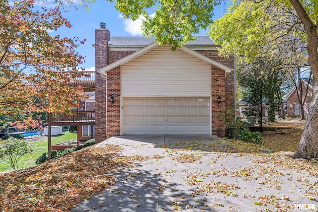 view of side of property featuring a garage