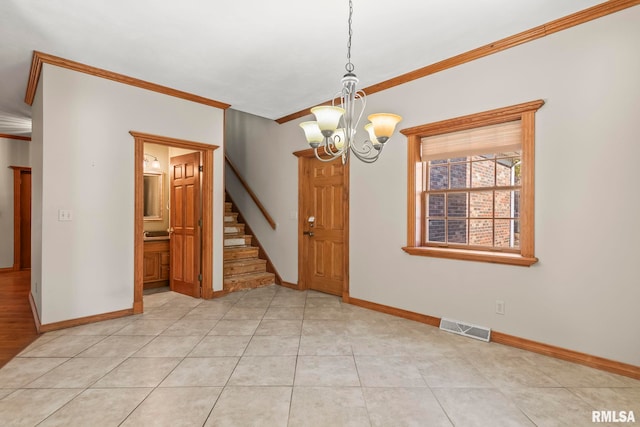 spare room featuring an inviting chandelier, light tile patterned flooring, and crown molding