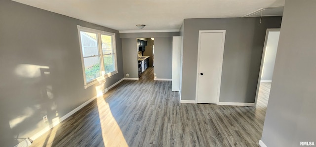 unfurnished living room with dark hardwood / wood-style floors