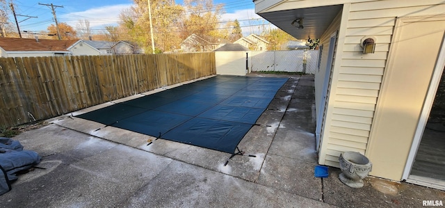 view of swimming pool featuring a patio area