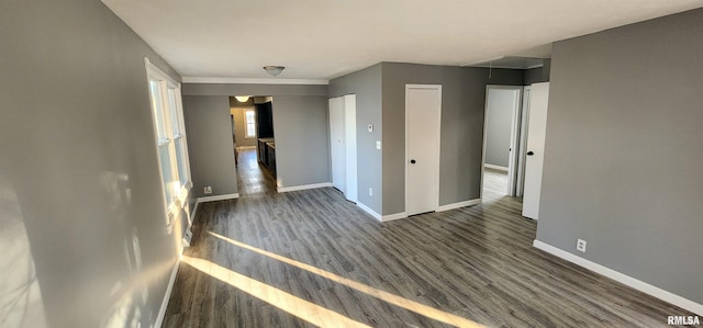 unfurnished bedroom featuring dark wood-type flooring