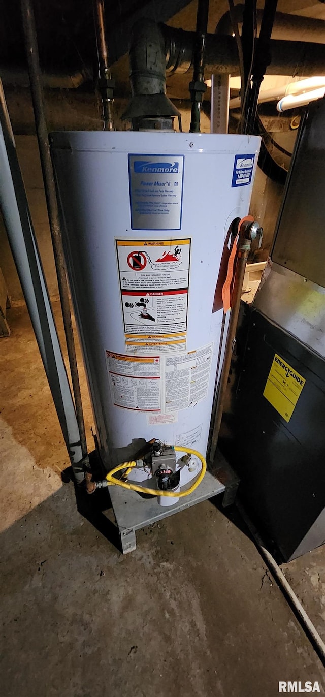 utility room featuring gas water heater