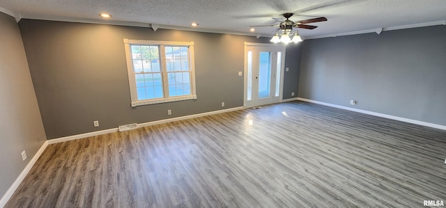 unfurnished room with a textured ceiling, ceiling fan, crown molding, and hardwood / wood-style floors