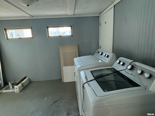 washroom with washing machine and clothes dryer