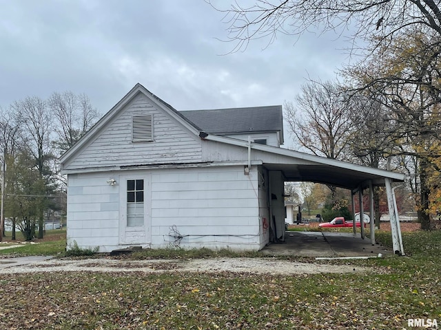 view of side of home featuring a carport