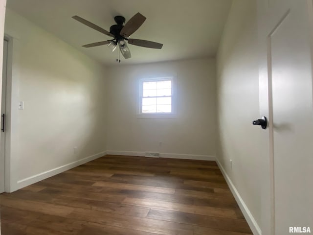 unfurnished room featuring dark hardwood / wood-style flooring and ceiling fan