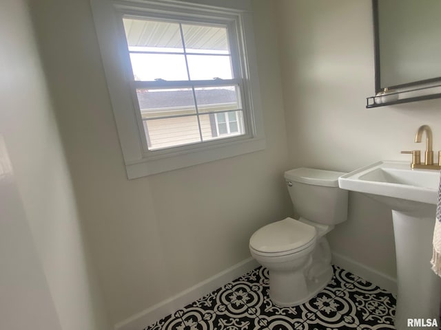 bathroom featuring tile patterned flooring and toilet