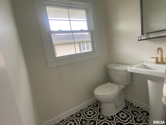 716 W Pauline St, Taylorville, IL 62568 - bathroom with baseboards, toilet, and tile patterned flooring