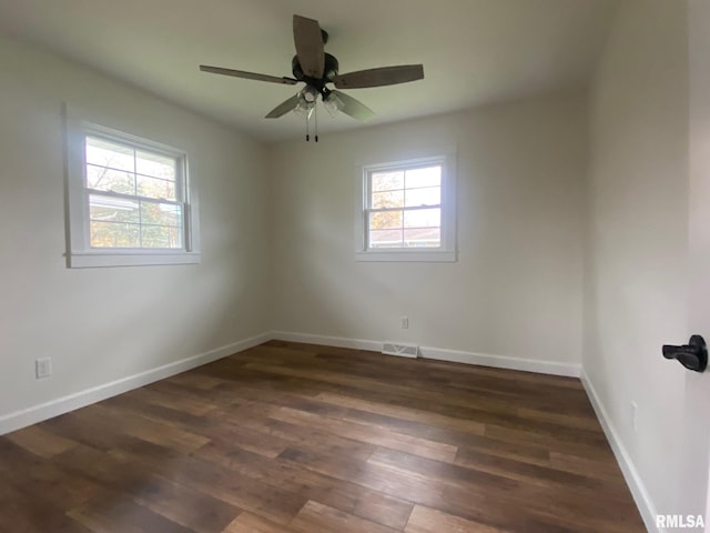 unfurnished room featuring dark hardwood / wood-style floors and ceiling fan