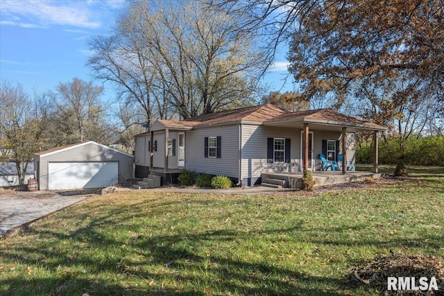 view of front of property with covered porch, a garage, an outdoor structure, and a front yard