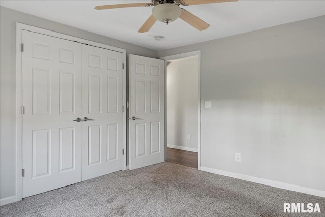 unfurnished bedroom featuring carpet, a closet, and ceiling fan