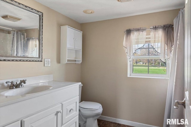 bathroom featuring tile patterned floors, a shower with curtain, vanity, and toilet