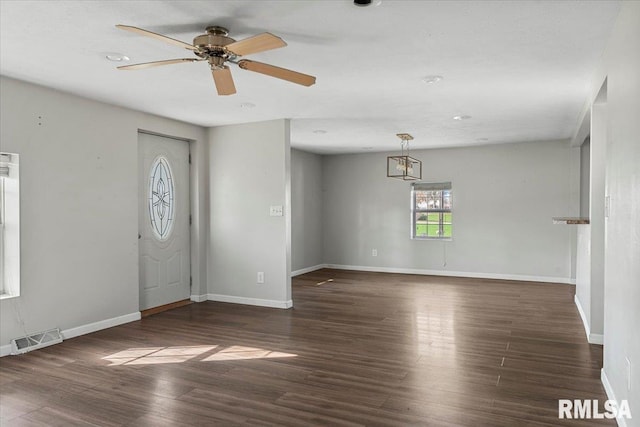 entrance foyer featuring ceiling fan and dark wood-type flooring