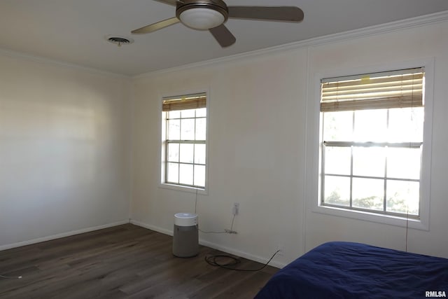 unfurnished bedroom featuring ceiling fan, crown molding, and dark hardwood / wood-style floors