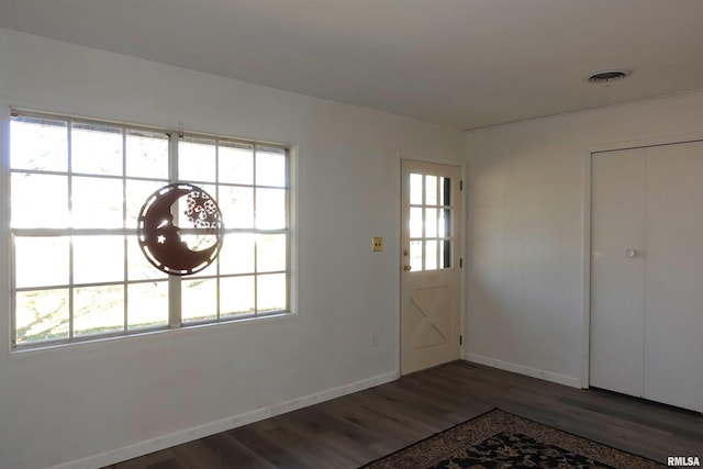 248 W Sanborn St, Galesburg, IL 61401 - entryway featuring wood finished floors, healthy amount of natural light, and baseboards