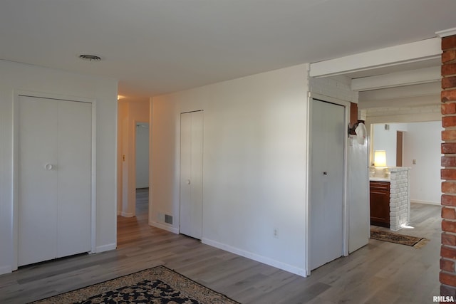 spare room featuring light wood-type flooring