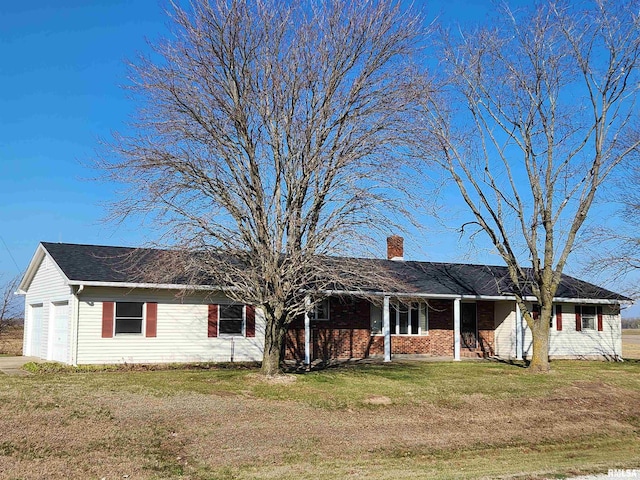 ranch-style home featuring a garage and a front yard