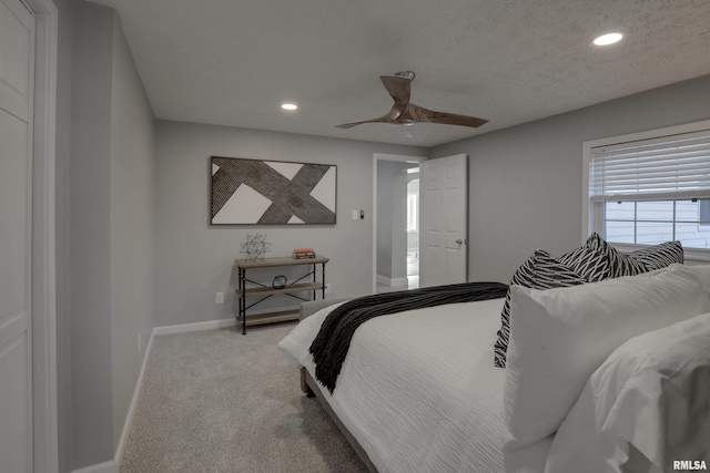 bedroom featuring carpet floors, recessed lighting, a textured ceiling, and baseboards