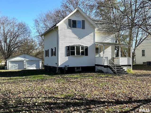 508 S Main St, Abingdon, IL 61410 - view of front facade featuring an outbuilding, a detached garage, and a porch
