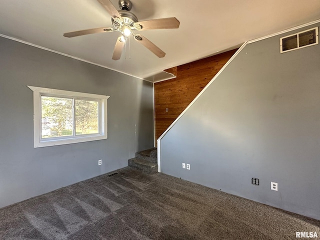 508 S Main St, Abingdon, IL 61410 - spare room featuring carpet, ceiling fan, stairway, and wooden walls