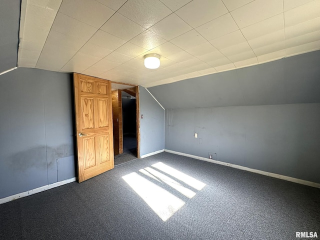 bonus room featuring carpet flooring and lofted ceiling