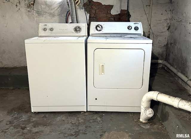 clothes washing area with independent washer and dryer