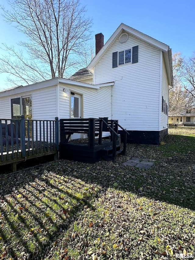 508 S Main St, Abingdon, IL 61410 - back of house with a chimney and a wooden deck