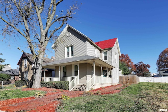 view of front of home with a front lawn and a porch