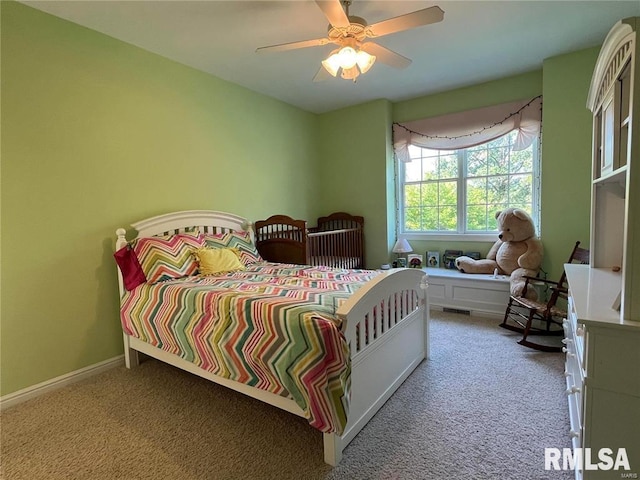 carpeted bedroom with ceiling fan