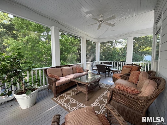 sunroom with ceiling fan, lofted ceiling, a wealth of natural light, and wooden ceiling