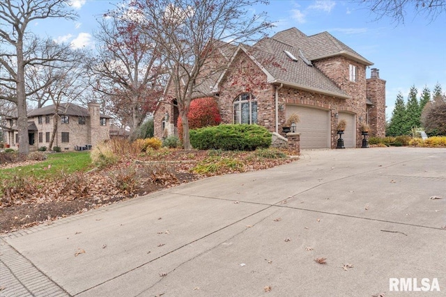 view of side of property with a garage