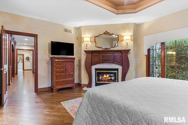 bedroom with dark hardwood / wood-style flooring