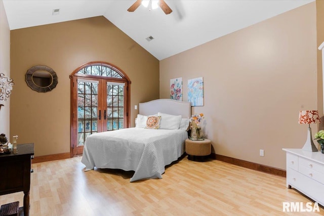 bedroom with ceiling fan, light hardwood / wood-style floors, high vaulted ceiling, and french doors