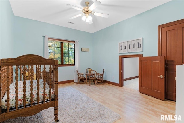 bedroom featuring ceiling fan and light wood-type flooring