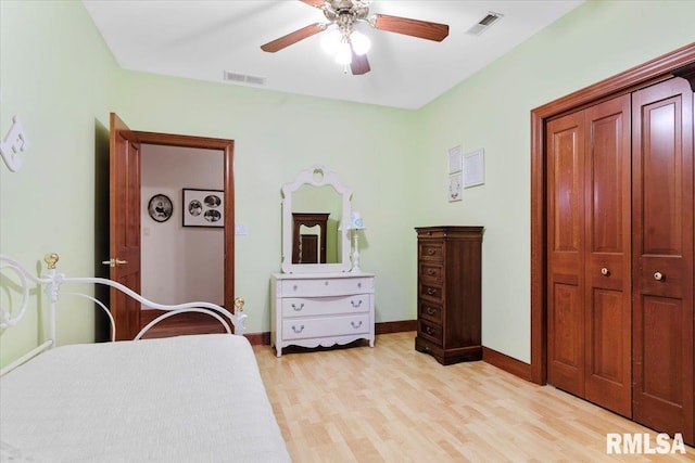 bedroom with light hardwood / wood-style flooring and ceiling fan