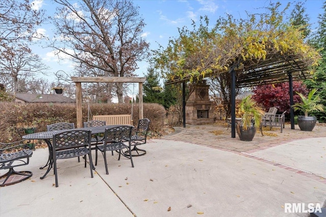 view of patio featuring an outdoor stone fireplace