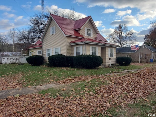 view of property exterior featuring a lawn