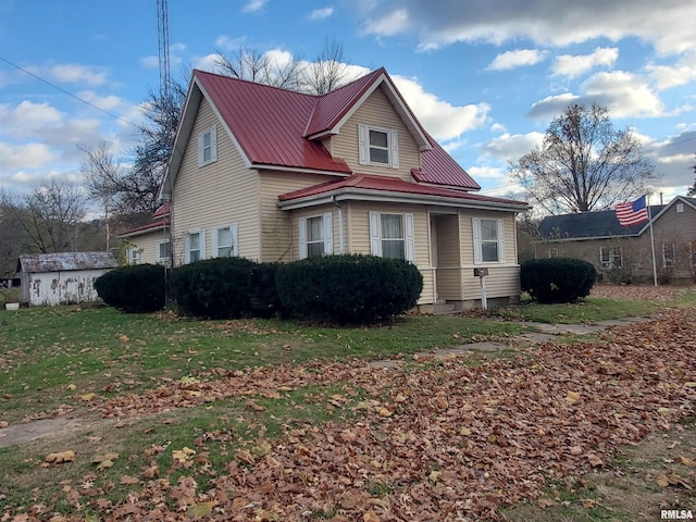 view of property exterior with a lawn