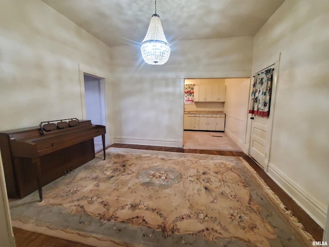 interior space with light hardwood / wood-style floors and a notable chandelier