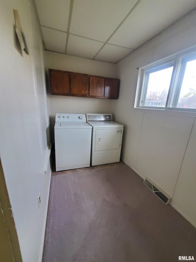 laundry area with washer and clothes dryer and light carpet