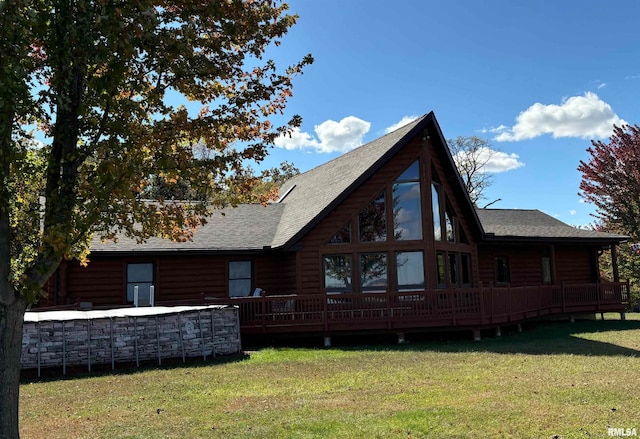 rear view of house with a yard