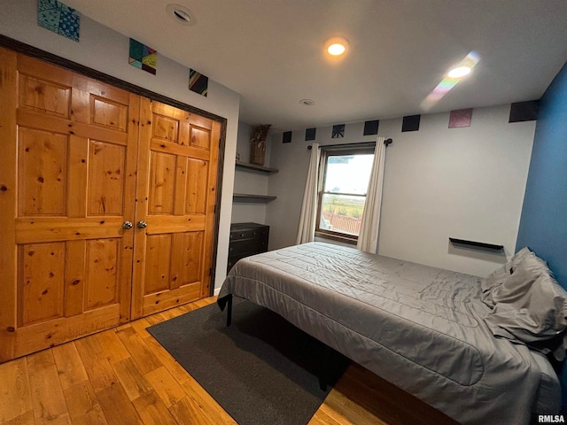 bedroom with light hardwood / wood-style floors