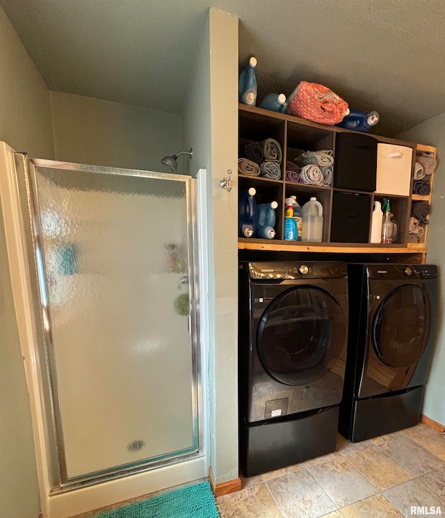 laundry area with washing machine and clothes dryer